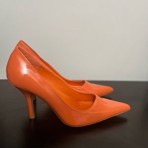 Orange heeled pumps